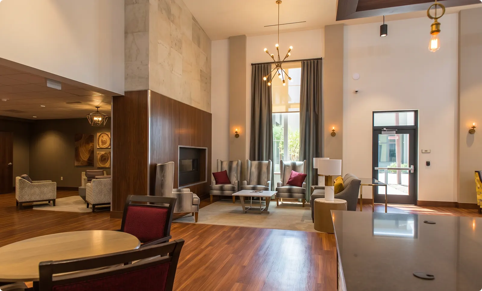 The double-height atrium at Buena Vista, with mixed seating and floor-to-ceiling windows