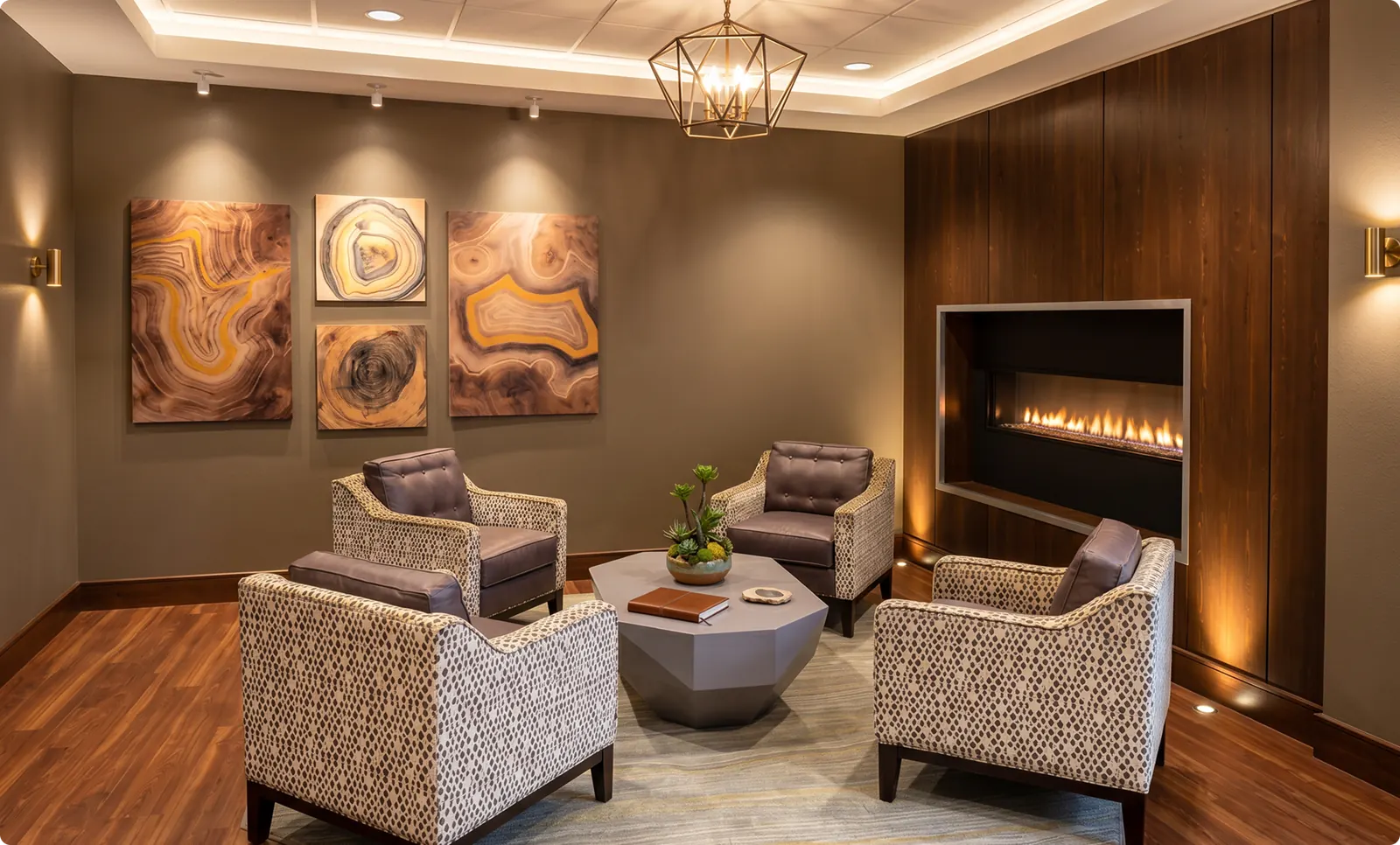 An intimate fireside lounge with four armchairs and a built-in fireplace